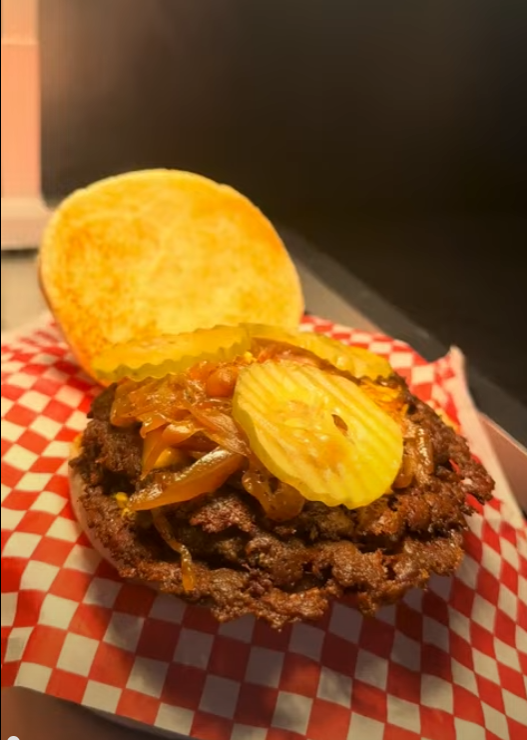 Bronze Burger loaded with grilled onions, pickles and Bronze sauce